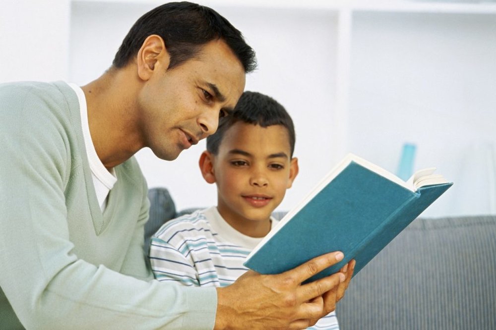 Father and son engaging in a playful activity